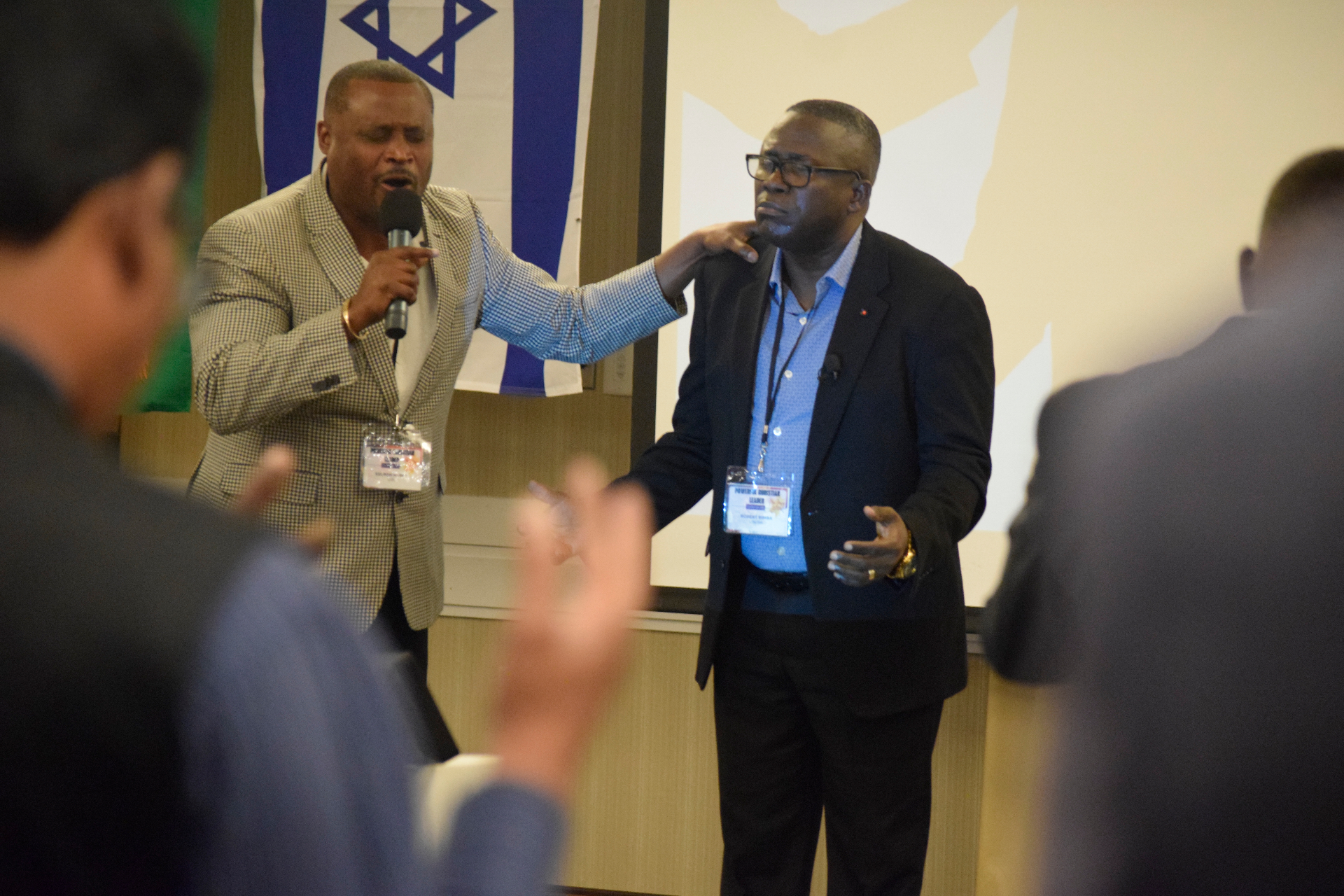 Christian leaders worshipping at a Power Ministries Canada conference
